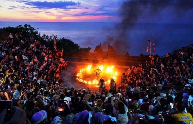 Kecak fire dance performed at the Uluwatu clifftop temple at sunset in Bali